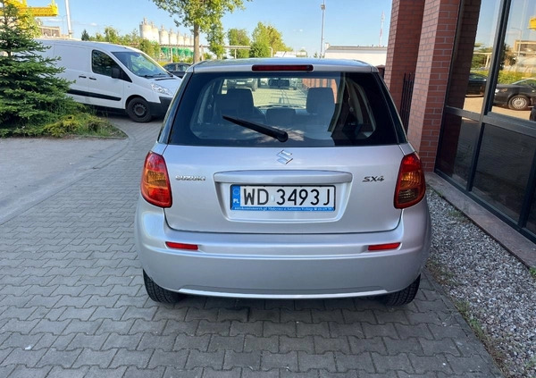 Suzuki SX4 cena 26900 przebieg: 153000, rok produkcji 2012 z Borne Sulinowo małe 254